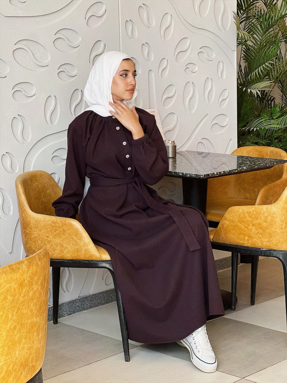 Plum abaya dress seated